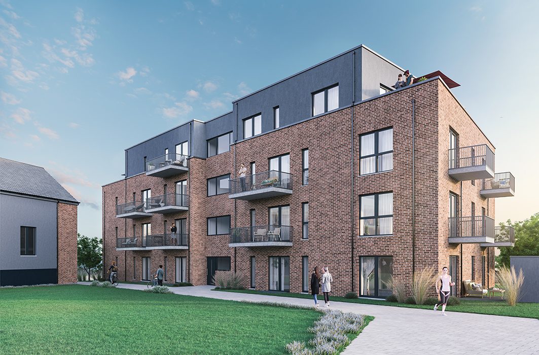 Moderne Mikroapartments mit Klinkerfassade und Balkonen am Ruppiner See, Außenansicht mit Grünfläche